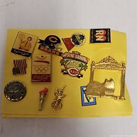 Overview of all twelve pins on yellow backing