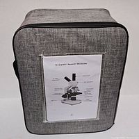 Front of grey fabric carrying case showing product sheet