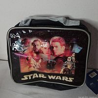 Front view of lunch bag showing Episode II character collage and Star Wars logo