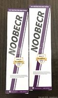 Front view of both Noobecr spray packages showing branding and size
