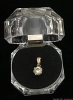 Pendant front showing clear stone and bail