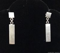 Front view of sterling silver bar dangle earrings
