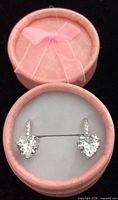 Heart-shaped sterling silver drop earrings in open pink round box