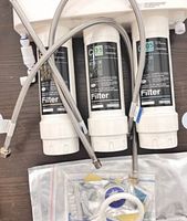 Frizzlife SK99 filtration system with cartridges, hoses and accessories displayed