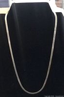 Full view of sterling silver chain necklace on display