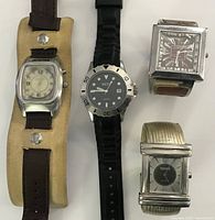 Group shot of all four wristwatches