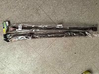 Pair of packaged metal balusters laid flat