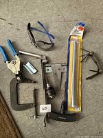 Overview of all tools and hardware laid out on floor