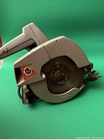 Left side view showing blade guard, BD emblem and body wear