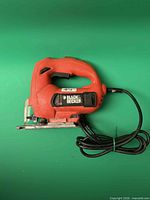 Left side view of Black & Decker corded jigsaw showing brand label and cord