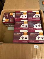 Seven boxes of Broadman Fellowship Cup Premium prefilled communion cups inside shipping carton