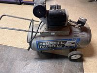 Full view of Campbell Hausfeld horizontal air compressor showing tank, motor, wheels and handle