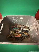 Bin containing many screwdrivers
