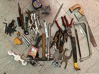 Entire pile of mixed hand tools on floor