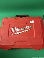 Closed red Milwaukee blow-molded case showing exterior logo