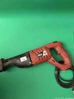 Overall view of Skil reciprocating saw showing handle, trigger and cord