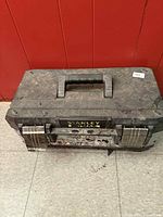 Closed Stanley FatMax toolbox top view showing handle and lid pattern
