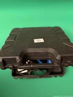 Closed black plastic carrying case