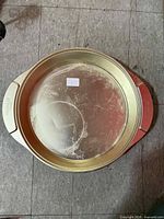 Top view of pan showing gold finish, round shape and wear