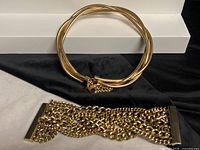 Bracelet and choker laid flat showing overall forms and clasps