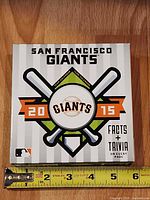 Front of boxed calendar showing team logo, year 2015 and size reference
