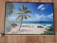 Full view of framed beach print with tape for scale
