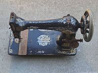 Top view of Singer treadle sewing machine head showing decals, condition