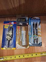 Front view of three sealed blister cards showing all items