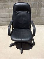 Front view of black leather high-back office chair