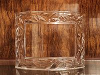 front view of clear glass frame showing overall shape and motif