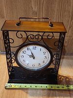 Front view full clock with tape showing width ~10-12 inches