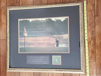 Full view of framed print with measuring tape showing height