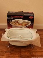 Full set showing dish in rack with lid and box