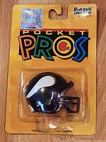 Front of sealed Riddell Pocket Pros package showing Minnesota Vikings mini helmet