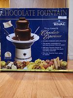 Retail box front showing Rival chocolate fountain and branding
