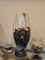 All three glass containers showing relative sizes and contents