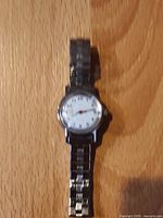 Full view of watch showing bracelet and dial