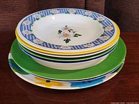 Stacked view of mixed-pattern bowls and plates