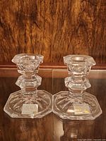 Two Mikasa crystal candlesticks front view with stickers visible