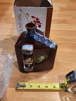 Front view of fountain with tape for scale and box in background