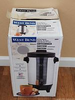 Retail box front showing West Bend 42-cup automatic coffeemaker imagery and details