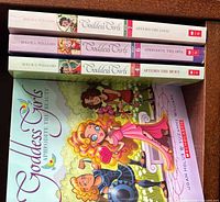 Spine view of three Goddess Girls novels and front cover of Aphrodite the Beauty