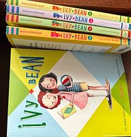 Stack showing spines of Books 2-5 and cover of Book 1