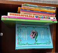 Stack of eight children’s books showing titles on spines