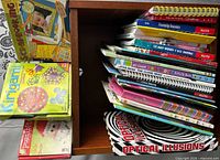 Stack of Klutz spiral craft books plus Scrapbooking, Kirigami and Optical Illusions books