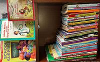 Books on shelf left section showing picture books and early readers