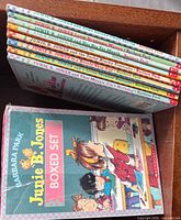 Oblique view of boxed set showing eight book spines and slipcase