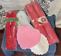 Group shot showing all craft items: ribbon, tubing, paper doilies