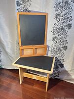 Wall-mount chalkboard and kids chalkboard table together for scale