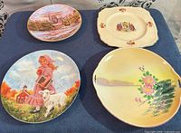 Front view of four assorted decorative plates